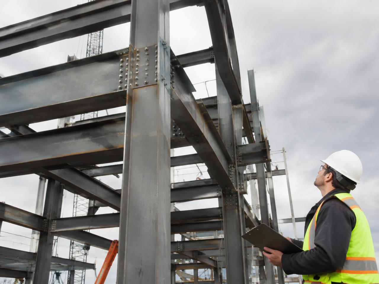 Inspector reviewing bolted structural steel connections